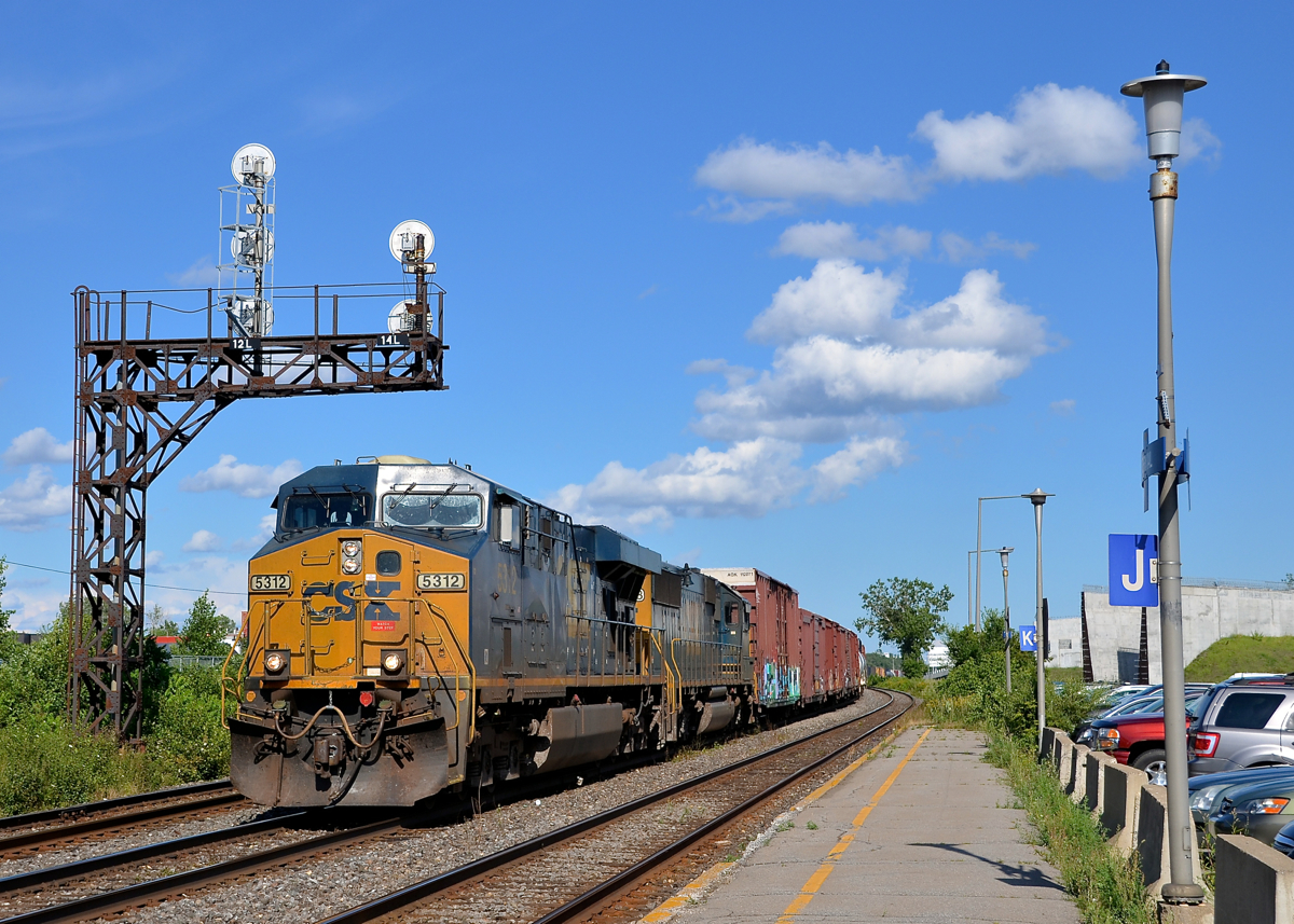 A CSXT ES40DC and SD50-2 (5312 & 8593) lead a later than usual CN 327 through Dorval.