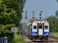 <b>New signals.</b> AMT 701 leads AMT 89 for Candiac towards its stop at Vendôme. In the distance are some new signals, the one at the right not yet cut in for a third track not yet in service.