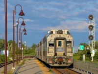 <b>Bright evening sun.</b> AMT 3008 is leading as AMT 29 approaches its station stop at Lachine during some bright evening sun.