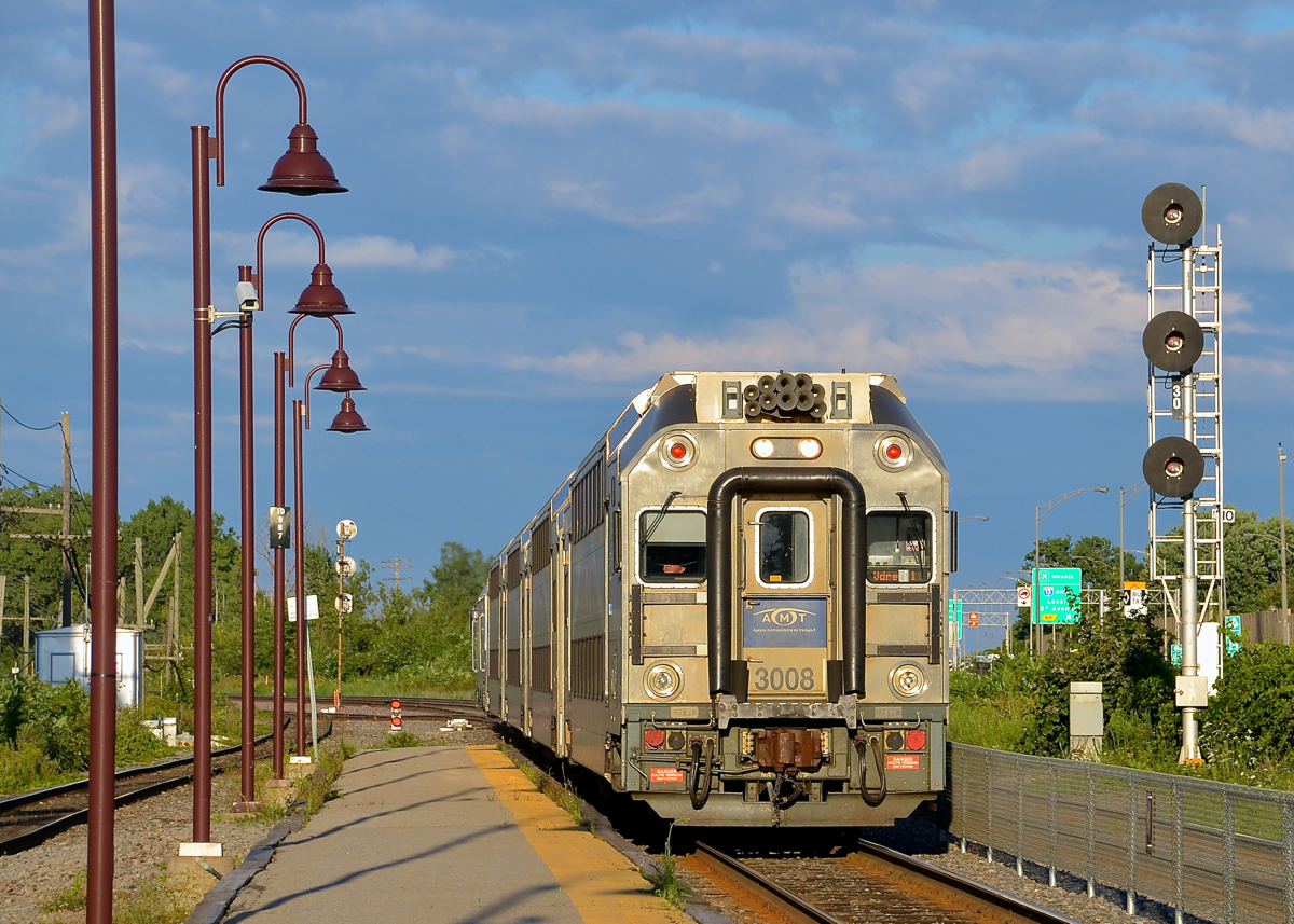 Bright evening sun. AMT 3008 is leading as AMT 29 approaches its station stop at Lachine during some bright evening sun.
