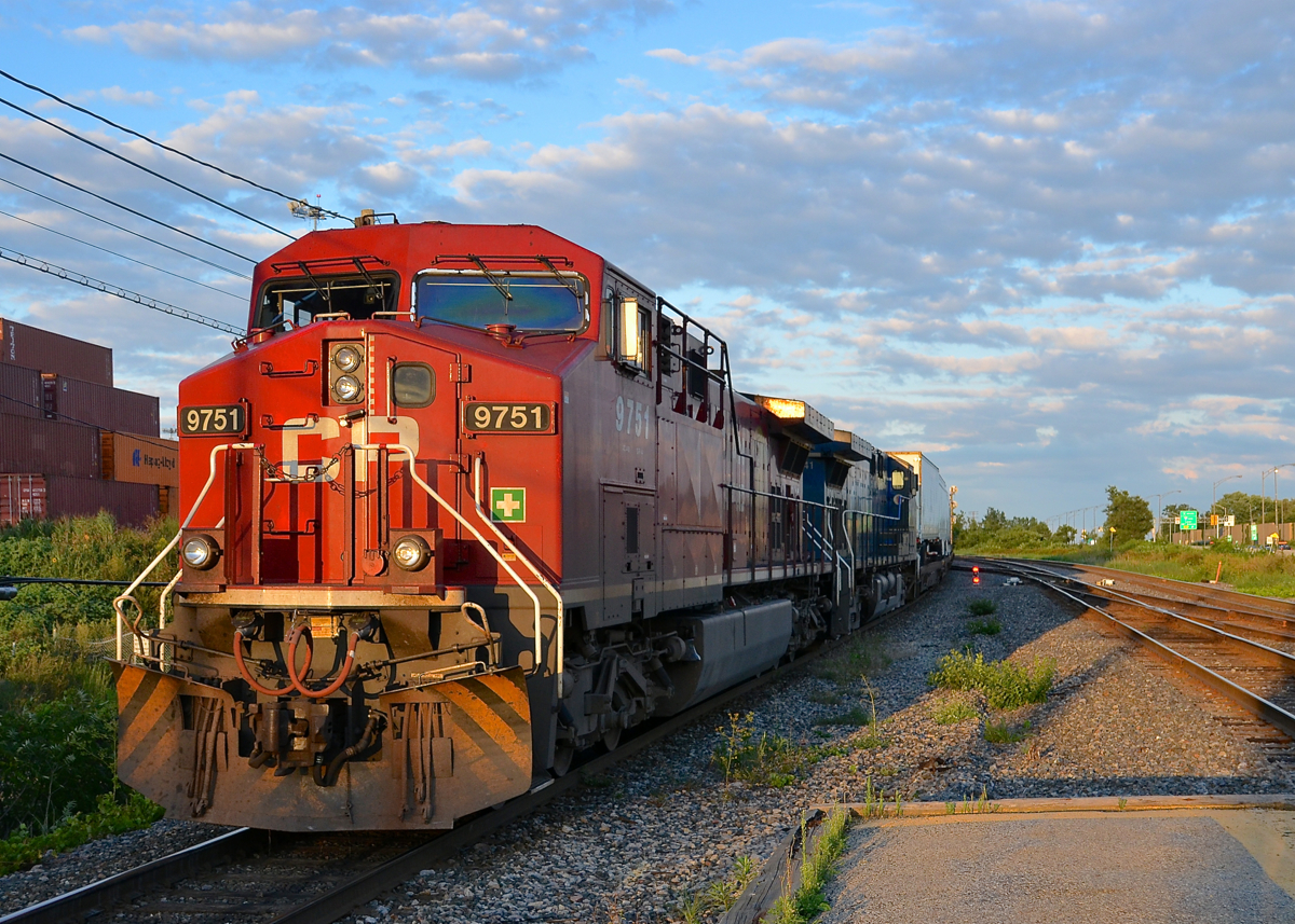 CP 133 heads west with CP 9751 (its plow still painted from its use in the movie Unstoppable) and CEFX 1041 through Lachine a bit before sunset.
