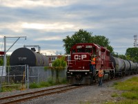 The Dorion Turn has just been tied down on the Lasalle Loop and the crew is about to head down Lafleur Avenue to have dinner. At left is a tank car in Total Canada, one of two clients remaining on the Loop.