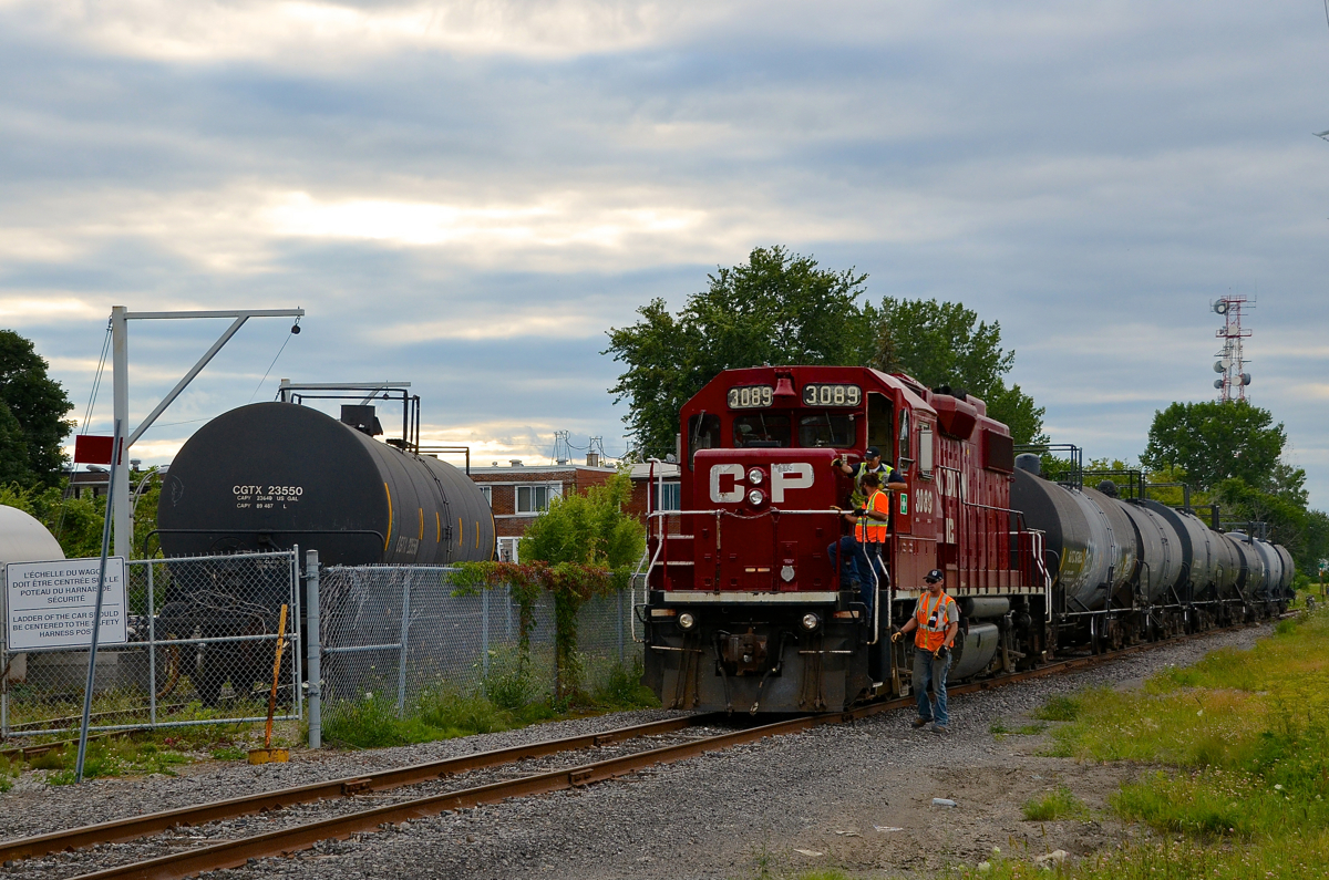The Dorion Turn has just been tied down on the Lasalle Loop and the crew is about to head down Lafleur Avenue to have dinner. At left is a tank car in Total Canada, one of two clients remaining on the Loop.