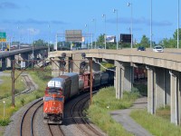 CN 5621 & CN 2592 lead CN X310 through Turcot West, with 552 axles total. It is passing MP 6 of the CN Montreal sub.