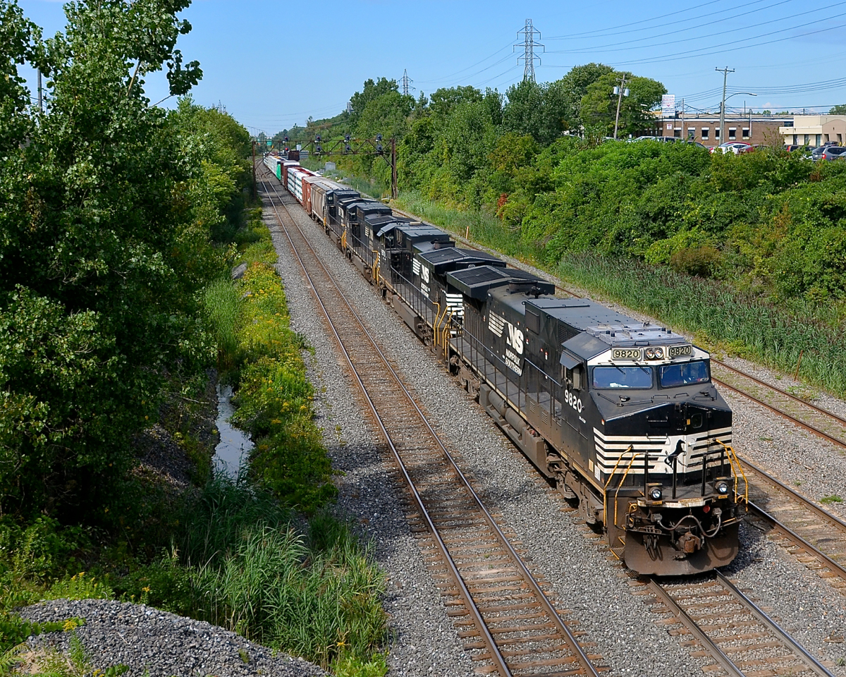Double your CN 528. CN 528 has two day's worth of CN 528/529 power (CP 930/931 while on CP tracks) and a longer train than usual as it exits Taschereau Yard with NS 9820, NS 9970, NS 8460 & NS 8359 for power.