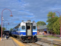 <b>Past Monteal West Station.</b> Cab car AMT 706 is leading AMT 93 past Montreal West station and is about to stop to pick up passengers before continuing towards Candiac.