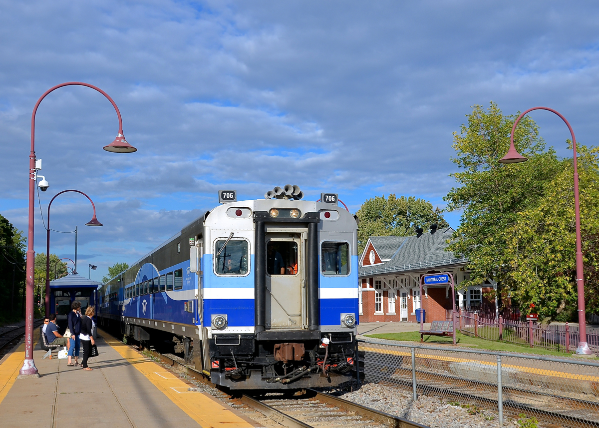 Past Monteal West Station. Cab car AMT 706 is leading AMT 93 past Montreal West station and is about to stop to pick up passengers before continuing towards Candiac.