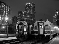 At Lucien L'Allier Station in Montreal, two of the last commuter trains of the rush hour are boarding passengers before heading west. At right is AMT 95, the 6:20 PM departure for Candiac and to its left is AMT 29, the 6:30 PM departure for Vaudreuil. At right is the Bell Centre, home of the Montreal Canadiens.