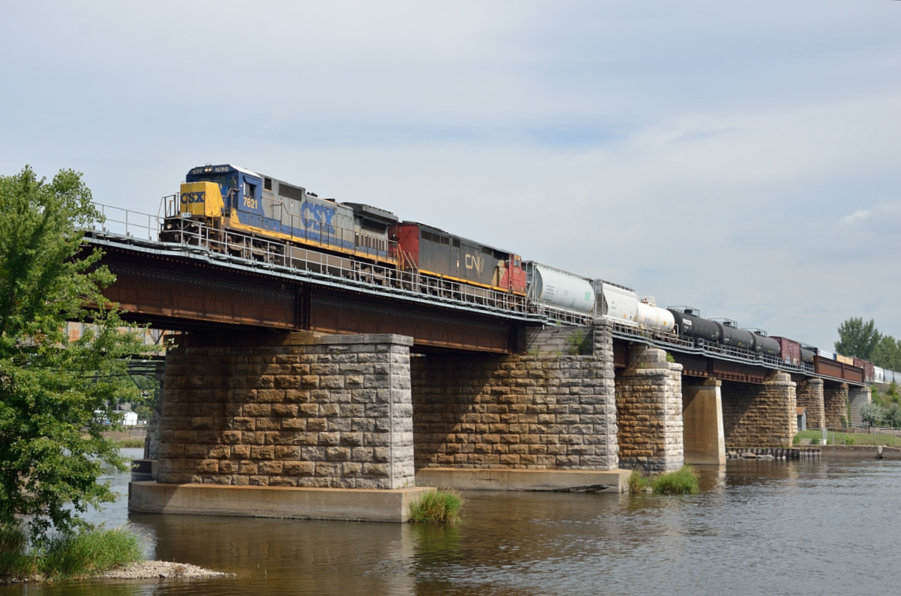 On its way to Massena, Syracuse and ultimately Selkirk, NY CN 327 crosses the Ottawa River on the Ste-Annes Bridge after departing Montreal.