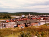 Remote and Dreary is what I think of Hornepayne, although I know some on this list might differ. First time I went up here in the '70s even the highway was but a shadow of what a highway should be. But for the train buff the place has its highlights. Note the huge station in the foreground, and administrative offices to the left. Note the huge train sheds, indoor shop and the world's last indoor roundhouse. Why? Because it is so bloody cold up there, thats why. Unfortunately the station has been closed, it is, at last visit, a forelorn and empty structure falling to the vandals. Neither the RR nor the town seems to want it. I understand that due to the elements (as in 'winter') a central all-purpose building that houses everything vital to operation of the community was constructed downtown. I had heard, however, that it was facing forclosure due to lack of tenants and local business. Now that I think of it, this place deserves another visit. :o)