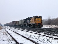 Fifteen minutes after it's counterpart passed through the town of Paris, Norfolk Southern train 328 screams through the junction with a pair of units a long way from their home. UP C40-8 9328 and TFM SD40-2 1401 races eastward towards Buffalo with five hoppers ex Trillium(Aylmer Co-op?) and the usual string of auto boxes from Talbotville Ford.