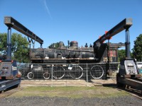 Engine 1531 is about to be lifted and placed on a flatbed trailer for its journey to the Simcoe County Museum. The engine and Caboose 79374 were relocated to allow the City of Barrie to replace a watermain and relocate Lakeshore Drive on to the former Newmarket Sub right of way.The rails of the Newmarket Sub between Barrie and Rama were lifted in the fall of 1996. The new road should be done in 2016.