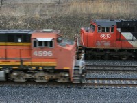 CN 435 has just completed it's work at Aldershot and was back on his train, when an EB showed up on track 3 with BNSF power leading...the leader...obviously had some recent nose work done. Taken from the berm at MP 35.7