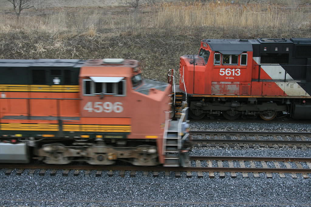 CN 435 has just completed it's work at Aldershot and was back on his train, when an EB showed up on track 3 with BNSF power leading...the leader...obviously had some recent nose work done. Taken from the berm at MP 35.7