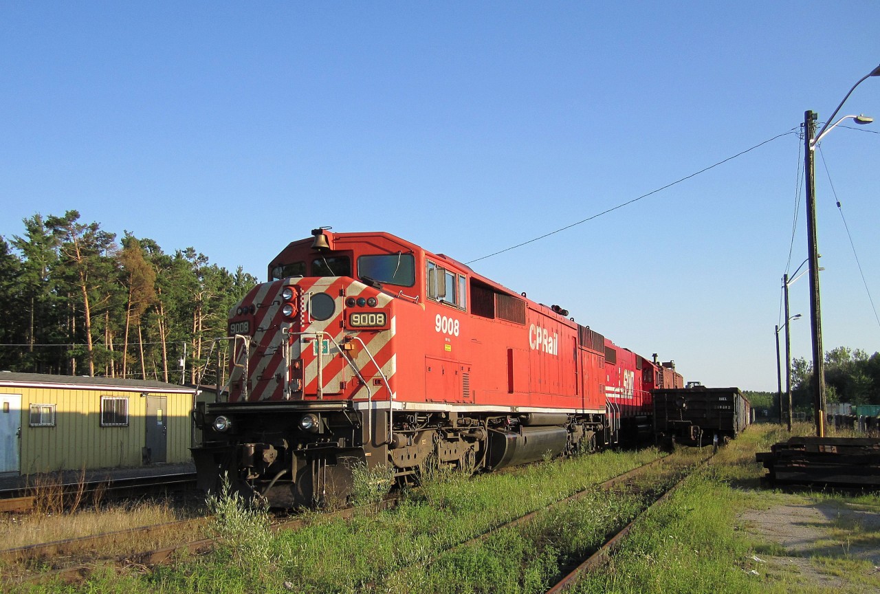 A red barn and a SOO SD-60 wait out the weekend a long way from the jobs they were built for.