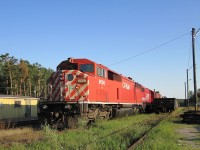 A red barn and a SOO SD-60 wait out the weekend a long way from the jobs they were built for.