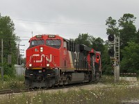 Canadian National mixed freight train, M314, rounds the corner at Washago, Ontario, lead by a pair of ES44AC's. 314 had a decent sized train, coming in at 584 axels on the Milepost 87.0 hotbox detector outside of Washago. He would be nearing his destination of CN Macmillan Yard in approximately 88 miles. 