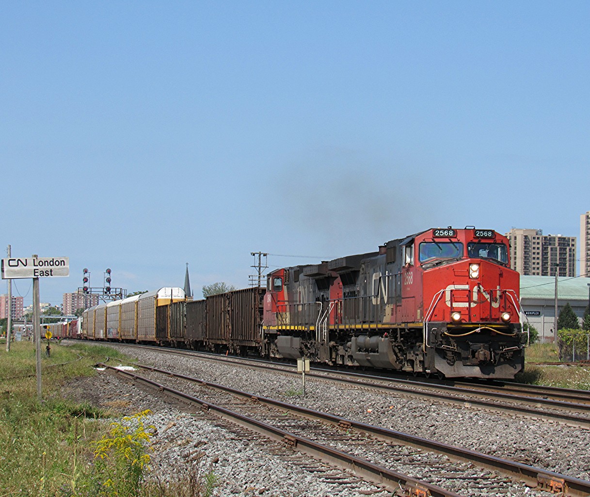Canadian National eastbound mixed freight, M384, is a little late this morning. Usually arriving in London around the 7 to 10 AM time, this was nearing the lunch hour. During the 13th of August, most eastbound CN freights were quite late. Not exactly sure why, but it happens here and there.