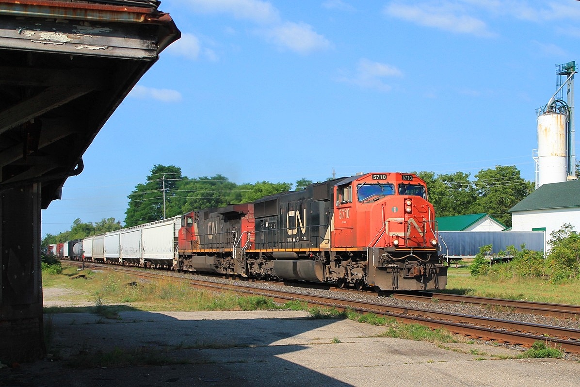 An important personal moment. The second unit, CN 2544, being my 1000th different CN loco. Seen passing the derelict old station with a very mixed freight.