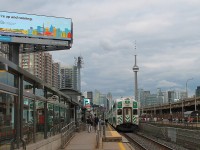 Go Train part of the urban landscape of Toronto. An early evening westbound stops at Exhibition station. 