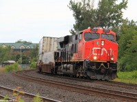 Northbound intermodal Q10721, a daily Montreal to Winnipeg train rounds the curve approaching the Centre St E road crossing in Richmond Hill with a solo ES44AC to handle all the stacks. This train, would meet 'The Canadian' VIA #02 at Quaker before proceeding again on its way to Winnipeg.