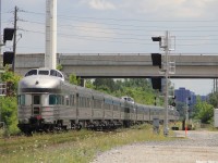 VIA 02 clears CN Doncaster Junction on its way to downtown Toronto, with the park car wrapping up the tail end as it passes in between 2 inactive 'vador' signals soon to be put into place properly.
