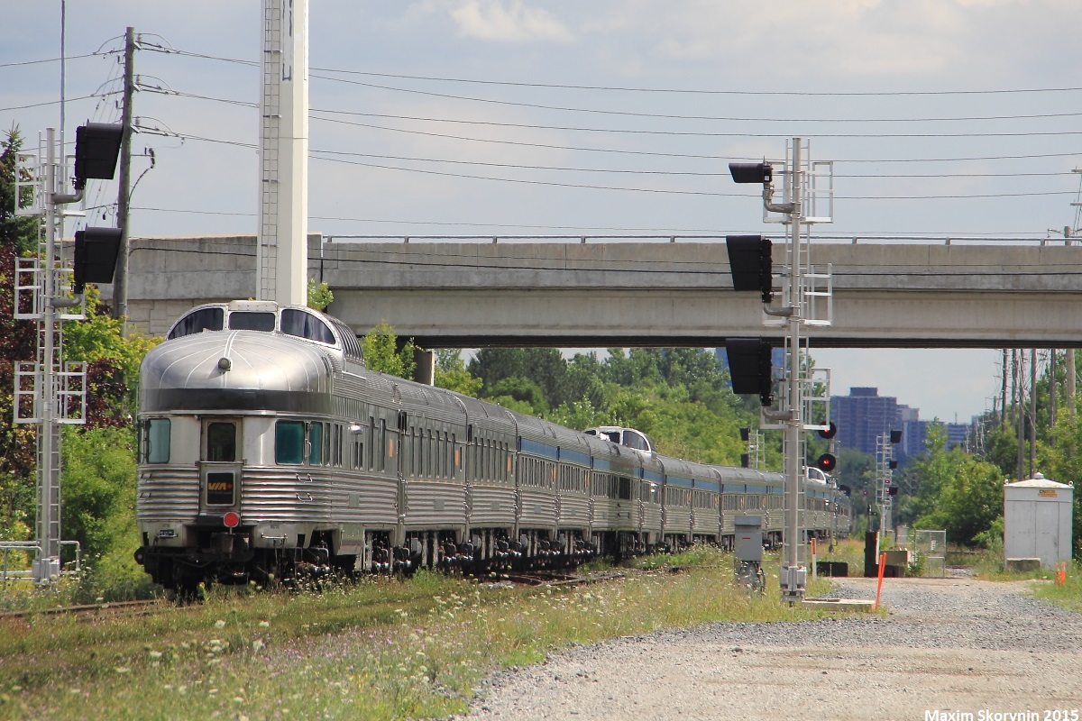 VIA 02 clears CN Doncaster Junction on its way to downtown Toronto, with the park car wrapping up the tail end as it passes in between 2 inactive 'vador' signals soon to be put into place properly.