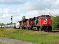 ES44DC CN 2335, DASH8-40C CN 2014 and DASH9-44CW head east through Ardrossan.