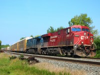 CP 8865 leads CEFX 1048 up to the Tremaine Road crossing on the Galt sub. with its manifest of auto racks and mixed freight.