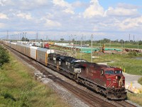 CP train 147 has a pair of NS units trailing as it storms past the "Expressway" yard at Hornby.