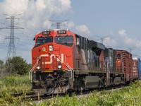 A massive westbound mixed freight, CN M369 comes through Bowmanville with double mid DPUs- CN 2036 and CN 2938