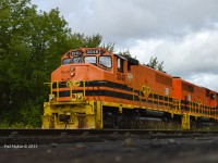 OVR 3048 & 3029 work the yard crossing the small creek as they build the east bound train on an overcast & rainy day