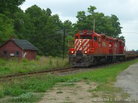And a photo that has aged well - many of these things are no longer possible - GP9's on CP? Nope. The frame train? Gone. That building at left - gone. Question is - what was it? It is clearly a railroad structure and quite old at that.. I'd bet it dates to the Credit Valley Railway though! <br><br>Sometimes it's best to hold onto your shots - in time they do age and eventually, your 'dreary crummy day shot' can turn into gold if you wait long enough.<br><br>In this photo, this is Train 141, the daily frame train - which is now on the St. Thomas Sub headed for St. Thomas. The frame train was an interesting thing - in 1997/8 CP put the St. Thomas sub on the block due to lack of traffic, but in 1999 they won a contract from GM to run frames from Formet (Magna) in St. Thomas to the GM Truck plant in Oshawa, putting shortline plans on hold. CP had to become creative - as in doing this, two crews would be required for 141/2 due to crossing terminals (from London Division to Toronto Division) and an exception was granted by the Union to allow a single crew to man the train - which was the London Division that crewed it. The train ran seven days a week and was very predictable - ordered about 0500 in St Thomas -  it was one of the hottest trains on the line, and as soon as it got to Oshawa, they hooked and hauled the empties turning immediately - same crew would usually bring train back to St Thomas. Due to this, crews loved the train as you were working basically, days, home at regular predictable times, thusly to hold this job, you basically needed to be top of the seniority list. Jeff Willsie was one of the men that held this job. Only until this frame traffic dwindled did CP re-activate the shortline plans - bringing us to OSR's operation today. Also interesting, around this time, in the event of major derailments on the CP or CN - this connecting track would be used to detour trains back to/from CN or CP - anyone shoot re-routes here? I never did!<br><br>So youngins - your lesson is things change - and fast. This is only 10 years ago. :) Get your shots, things will continue to change as they always have :) Corrections and insight always welcome, add in comments please.