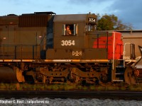 <b>The Engineer</b> has his movement safely under control as GEXR 518 switches cars in Kitchener yard. The sun has mere minutes left to shine as the solar terminator is about to arrive, bringing with it the familiar darkness of nightfall. 