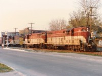 Wandering around in Niagara Falls one night a long time back, hoping to hear of the Chessie coming over, I was positively shocked to see TH&B power. Was able to grab this shot just after it entered Canada, but due to traffic (and traffic lights) there was no way I was going to beat this thing to Clifton Hill. So this was as good as it got. It was my understanding this train was usually after dark, and for once, it was early. Power is TH&B 73, 71 and 77. The streets here have all been realigned since then, but it used to be Elizabeth Pl alongside and Huron St crossing the train is going thru. Almost close enough to be street-running.:o)