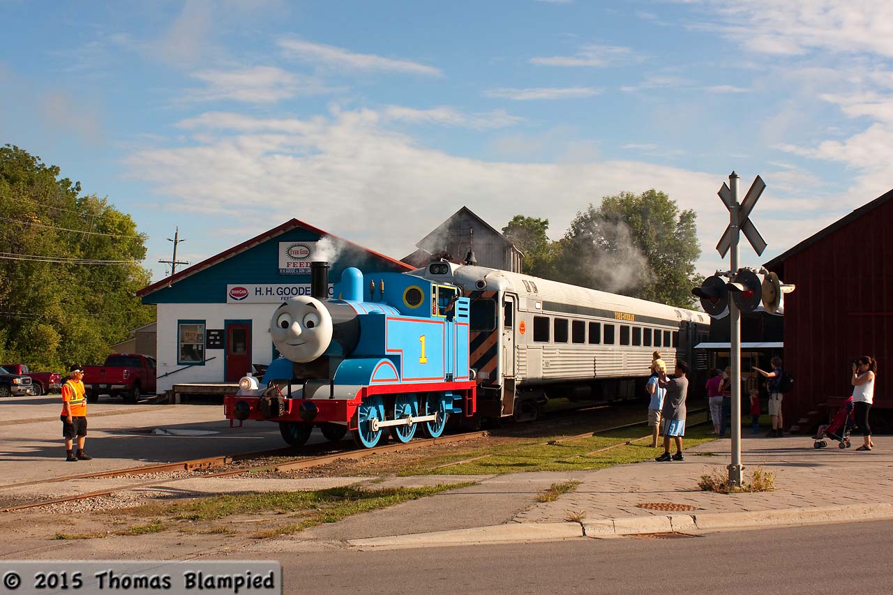 While the  Thomas the Tank Engine  stories faded during the 1970s, the 1984 television series ignited a passion for the "really useful engine" that has never gone away. Generation after generation of children around the world now grow up on a steady diet of shows featuring either the model Thomas or the hideous computer-generated version. The franchise has become so successful that full-size Thomas the Tank Engines now tour North America as part of HIT Entertainment's "A Day Out with Thomas" events. This year, the York-Durham Heritage Railway in Uxbridge was able to secure the tour and sold out six days of trips with Thomas. Surprisingly realistic, Thomas is seen leaving Uxbridge with the first train on the second day of excursions. While the engine isn't steam, the smoke effects are good and the moving face is positively disturbing. I have never seen such large crowds for the train in Uxbridge, and the event is a great success for the YDHR. (And yes, I do share my name with engine number 1!)