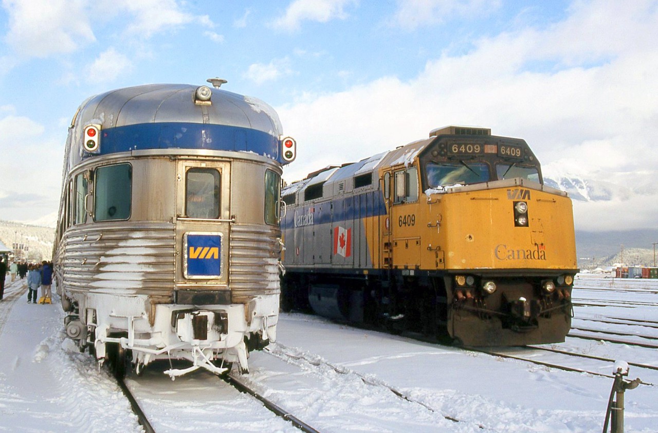 The Canadian's stainless steel Budd "Park" dome-observation-bullet-lounge car meets The Skeena's F40PH-2D 6409, at Jasper AB. VIA #2 and #5 together was not a common meeting, but possible today since #2 had been delayed.