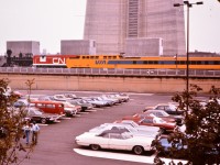 The final shot in the Turbo Trilogy is the unobstructed mural on the concrete retainer wall at the base of the CN Tower. The young couple walking through the parking lot turn to see the real Turbo as is whines out of Union Station on its way to Spadina shops.