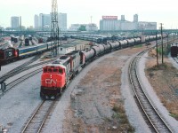 CN 9506 and 9632 snake westward around the massive VIA facility that used to be located in downtown Toronto. It is hard to imagine all that equipment back there not turning a wheel, therefore not making a nickel. On the left, CN 8513 is moving some passenger equipment while the Turbo is visible in the background.