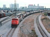CN 9506 and 9632 snake westward around the massive VIA facility that used to be located in downtown Toronto. It is hard to imagine all that equipment back there not turning a wheel, therefore not making a nickel. On the left, CN 8513 is moving some passenger equipment while the Turbo is visible in the background.