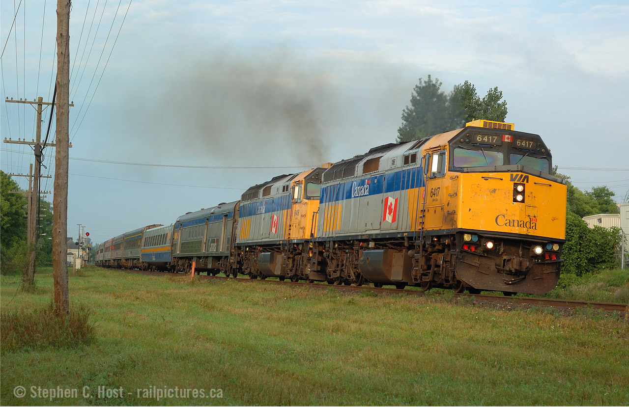 Forget the new stuff - here are MY oldies. I started taking photos a few years prior and Ingersoll was the place to be - or so it seemed. Why? trains went through town at FULL speed... even NS 327/8 and the Roadrailer did every bit of their 70 MPH timetable freight speed, while everything else was restricted to 60 sans passenger. A great place if you want to see full speed action with the amenities of a town a short hop away. Photography was.. well.. it was a nice place to see trains, wasn't it :) 
And a photo that's definitely aged well - VIA 70 with a pair in the old scheme, giving 'er to get up to track speed after a station stop at Ingersoll. I'm sick of the new stuff and I'm going to be going into my archives for a bit. Maybe a few of the gang on here will do the same? Pull out your oldies - this modern stuff is boring! Trains used to be cool, right?