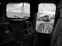 It's a gloomy day looking out from the former control cab, now a parts unit on the OSR. The work is done and a pair of Montreal built MLW's back down the water track for the barn at Guelph Junction.  