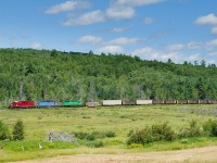 NBSR SD40-2s 6315, 6332 and 6200 head west on the McAdam Subdivision near Clarendon, NB with a 64 car train 907-14. 