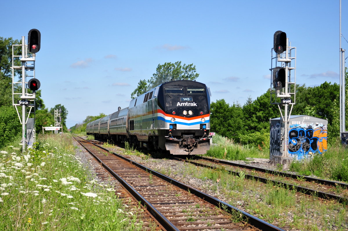 Amtrak 145 had escaped my lens a few times prior to this day, coming thru Canada 3 times before. Luckily this time, I had time to get to my location with time to spare, as the Maple Leaf was a few minutes late. I don't believe it's come through since. Amtrak usually sends a few different heritage units through here a year so it adds some fun to catching the usually dull Maple Leaf.