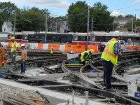 Installing new trackwork at the south end of the TTC Russell Carhouse, in preparation for the new LRV's that will be housed here.  The track switches, 21 in all, are being raised so the longer street cars will be able to negotiate the complex track layout on Eastern Avenue.  