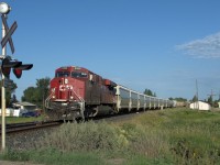 Rounding the bend early in the AM, even had a caboose on the end.