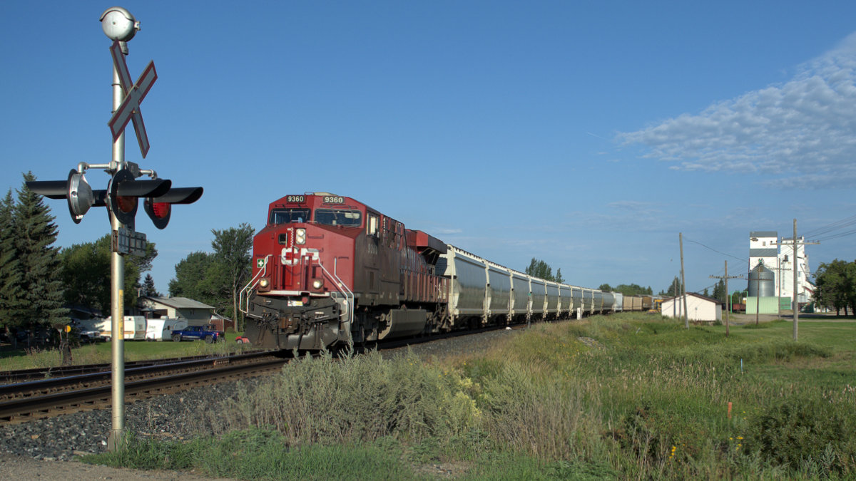Rounding the bend early in the AM, even had a caboose on the end.