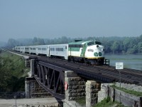 GO Transit #908 formerly Ontario Northland #1514 bringing up the rear of a westbound commuter crossing the Rouge River east of Toronto on the beautiful spring morning of May 28, 1978
