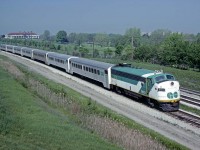 Go Transit FP7 #900 leads a late morning eastbound commuter under the Kingston Rd overpass on May 29, 1978.