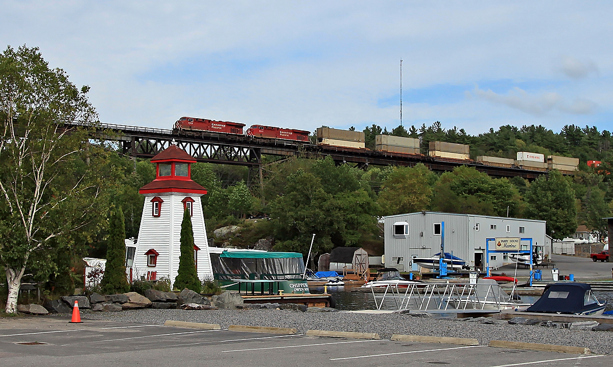Unknown (by me anyway) CP stack train heading over the Seguin River in Parry Sound.